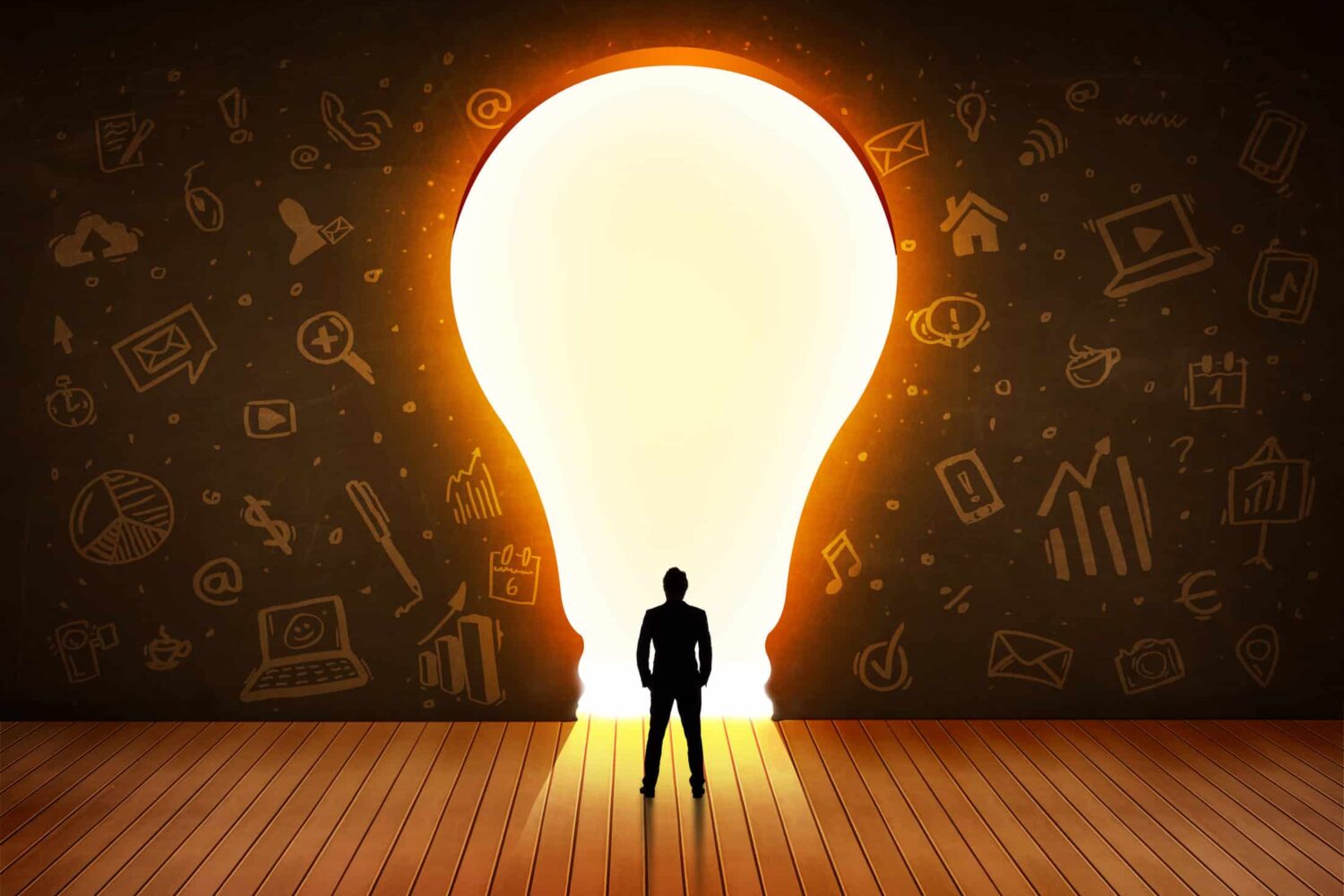 Image showing leader looking at a light bulb in the wall navigating the decision of whether to hire employee vs. marketing agency