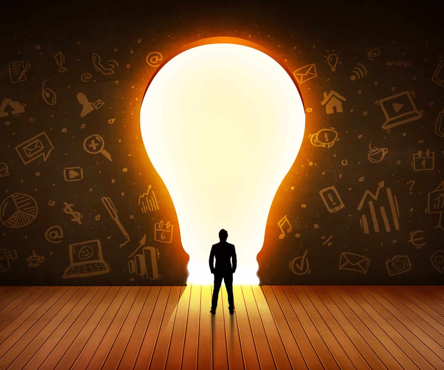 Image showing leader looking at a light bulb in the wall navigating the decision of whether to hire employee vs. marketing agency