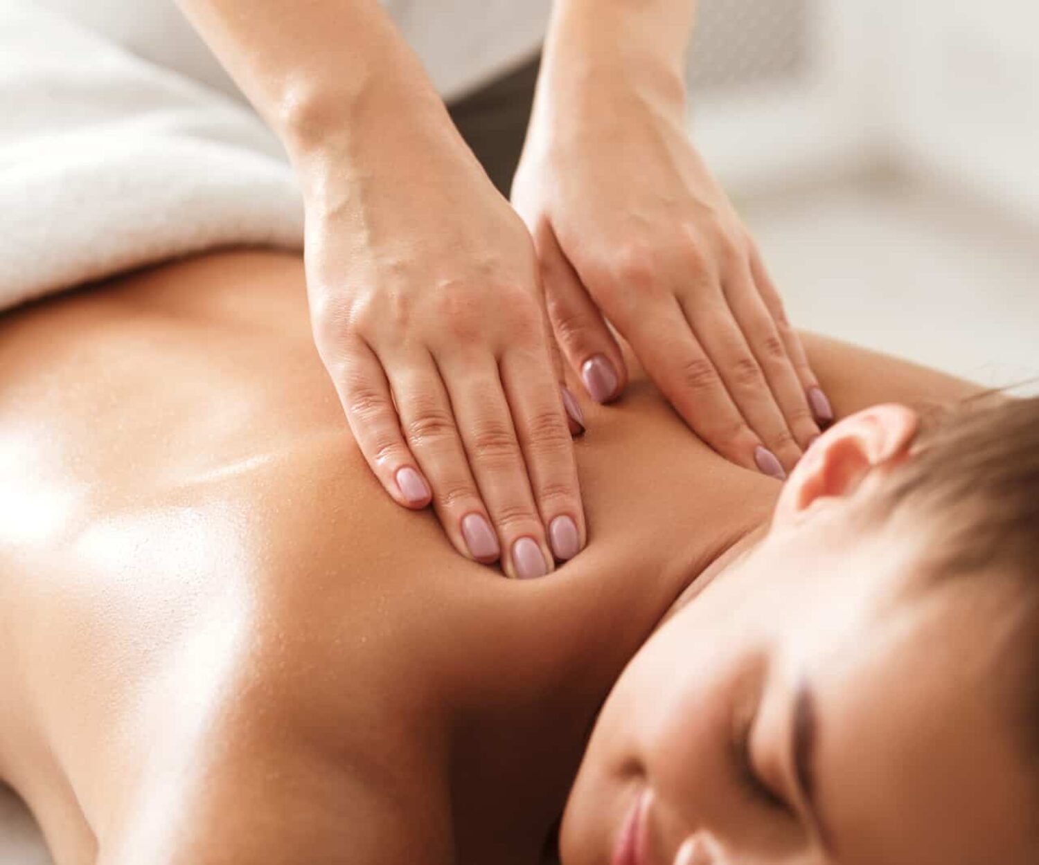 A image of a women receiving a calming massage used to invoke emotion in marketing communications.