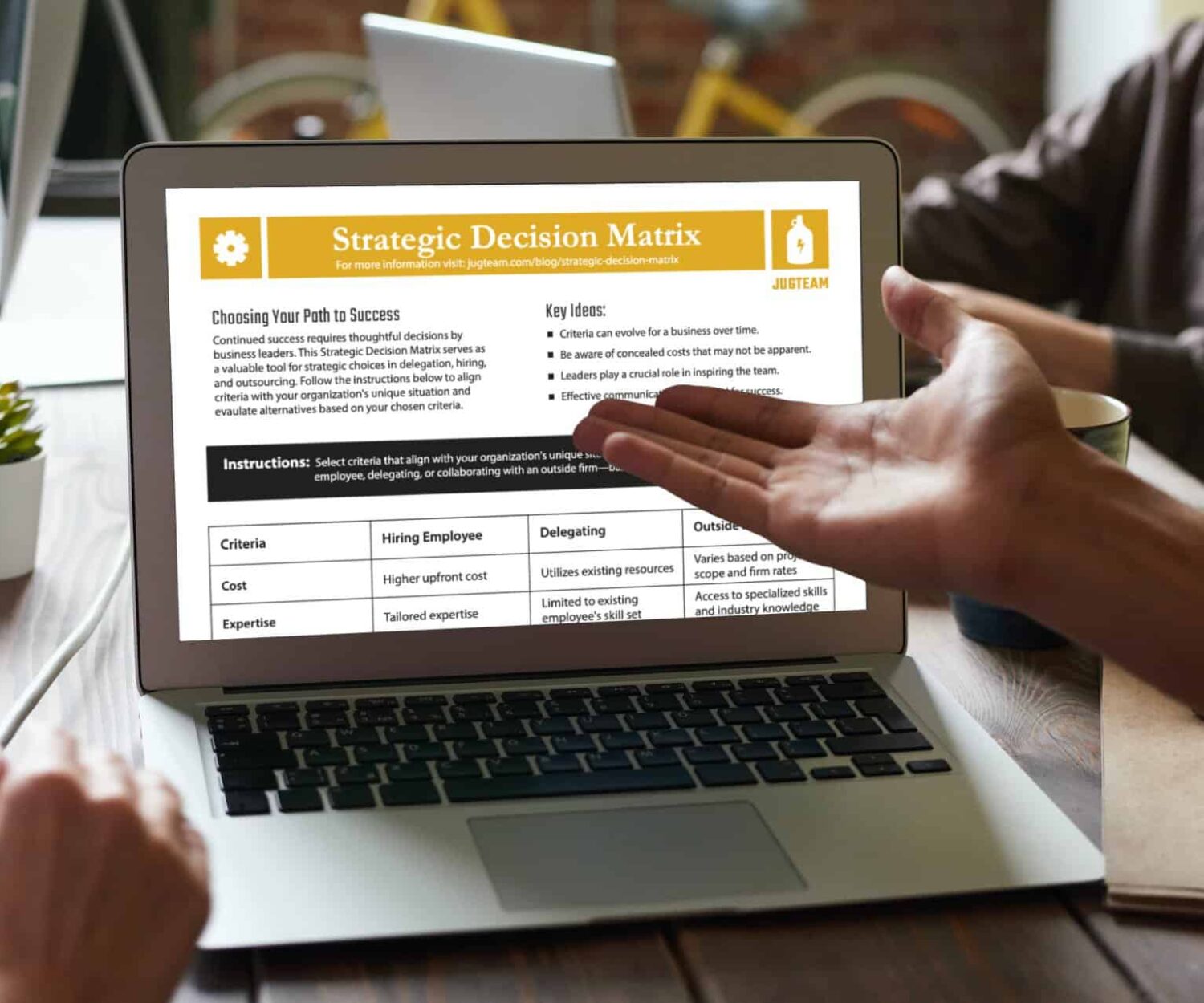 Laptop Computer Screen with Strategic Decision Matrix Shown